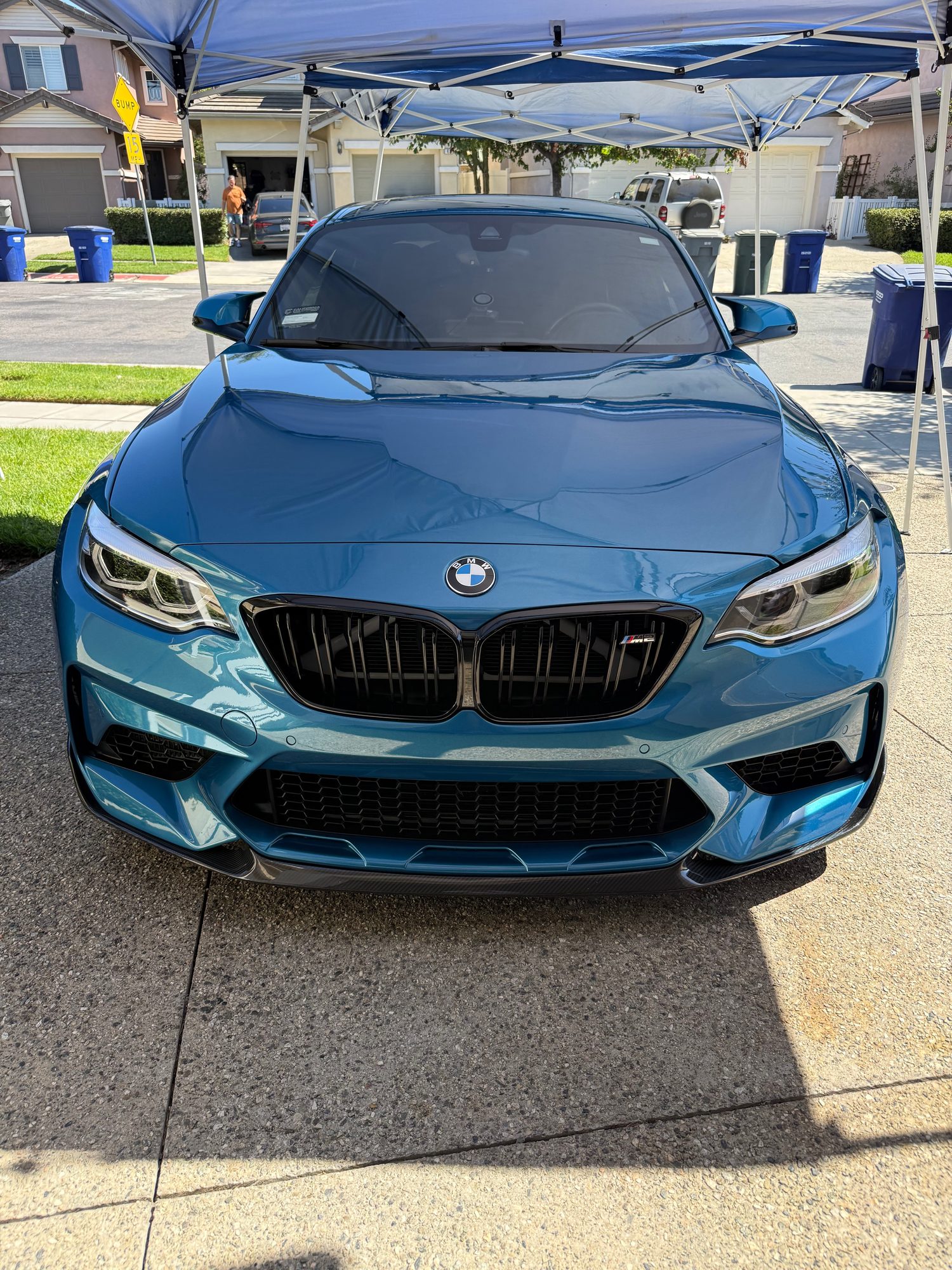 Freshly detailed BMW M2 under the Calvillo mobile detailing canopy
